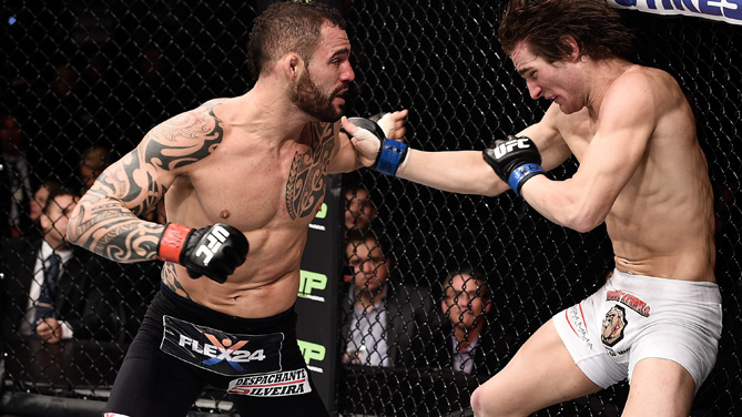 Santiago Ponzinibbio of Argentina punches Sean Strickland of the United States in their welterweight bout during the UFC Fight Night at Gigantinho Gymnasium on February 22, 2015 in Porto Alegre, Brazil. (Photo by Buda Mendes/Zuffa LLC)